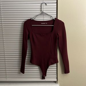 maroon body suit